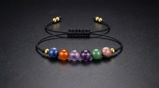 Six-gemstone study focus bracelet with Rhodonite, Moss Agate, Fluorite, Amethyst, Carnelian and Sodalite on black adjustable cord