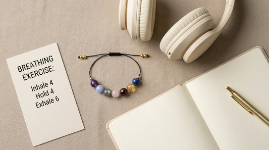 Anxiety support gemstone bracelet styled beside a journal, pen and herbal tea on a soft, neutral background